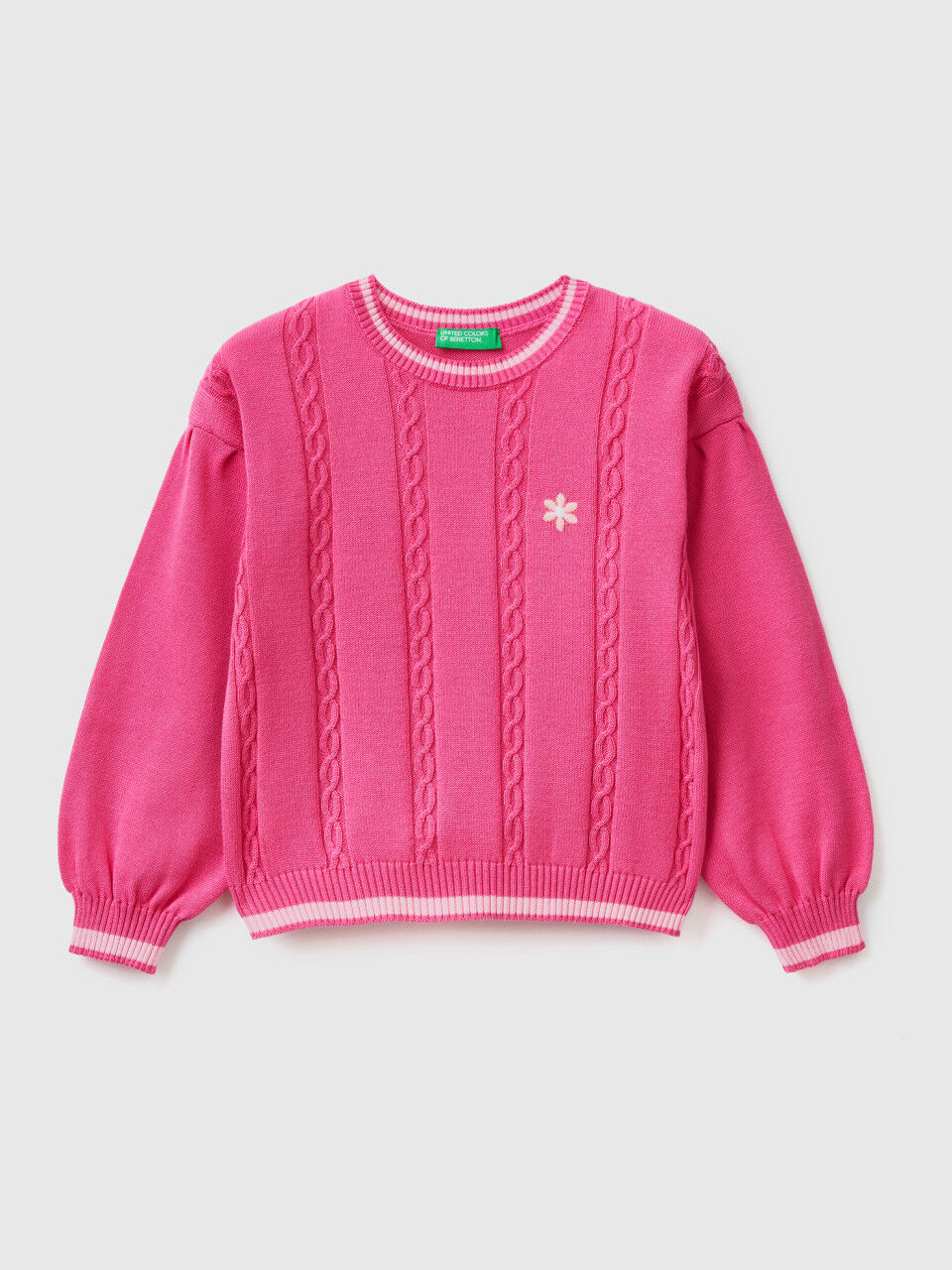 Sweater with cables and embroidered flower