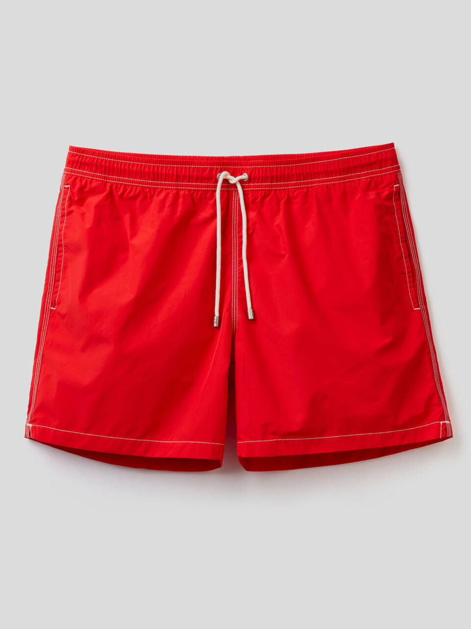 Swim trunks with clashing details image number 1