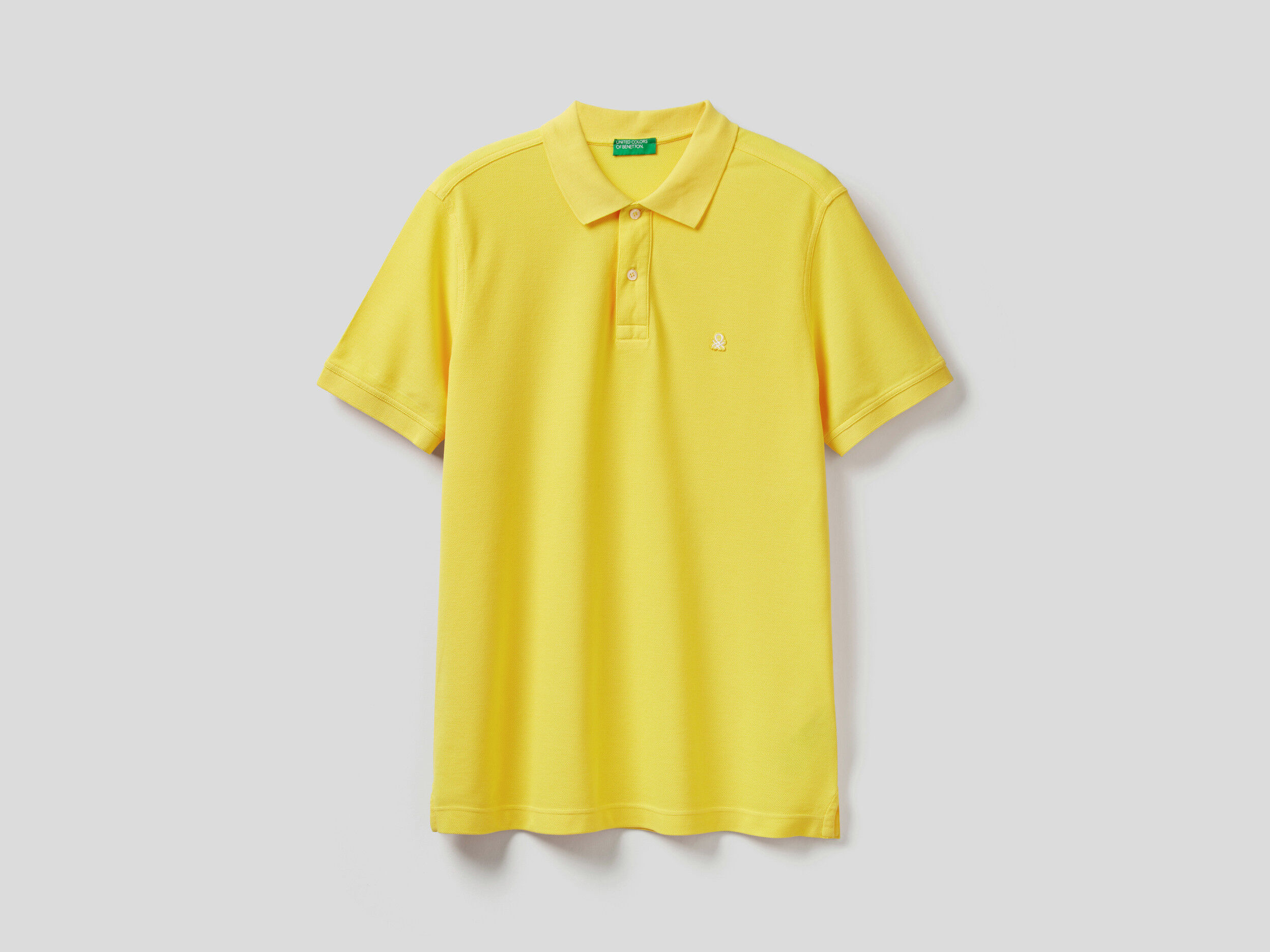 yellow short sleeve polo shirt